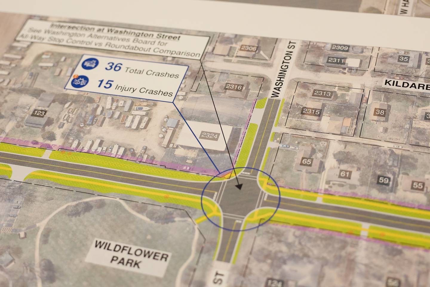 A map shows the proposed round-about at one of the more dangerous intersection at Mills Road and Washington Street during an open house on the Mill-Cherry Hill Road Study at the Nowell Park Recreation Center in Joliet on Tuesday, July 30, 2024.