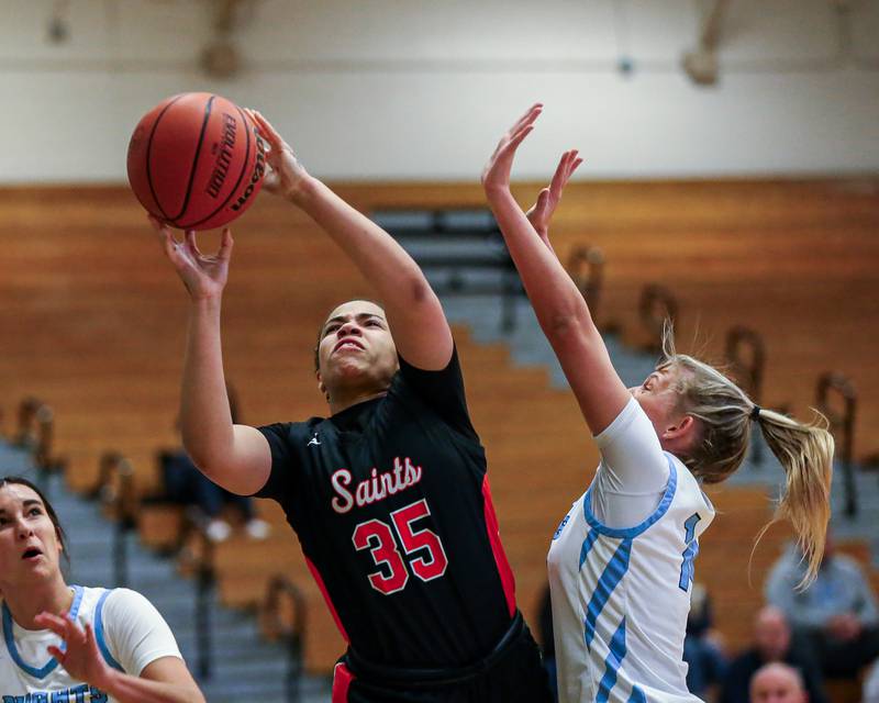 St Charles East's Corinne Reed (35) puts up a shot underneath the basket at the York Thanksgiving Tournament. Nov 13, 2023.