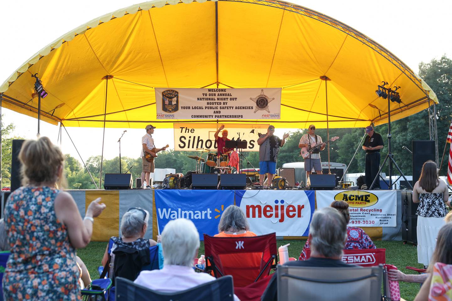 Attendees applaud as The Silhouettes take the stage during National Night Out at Perry Farm Park in Bradley on Tuesday, Aug. 5, 2025.