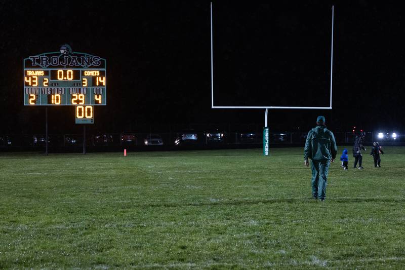 Dwight head coach Luke Standiford leaves the field behind his family following Dwight's 43-14 victory over Clifton Central in second round playoffs on Saturday, Nov. 8, 2025.