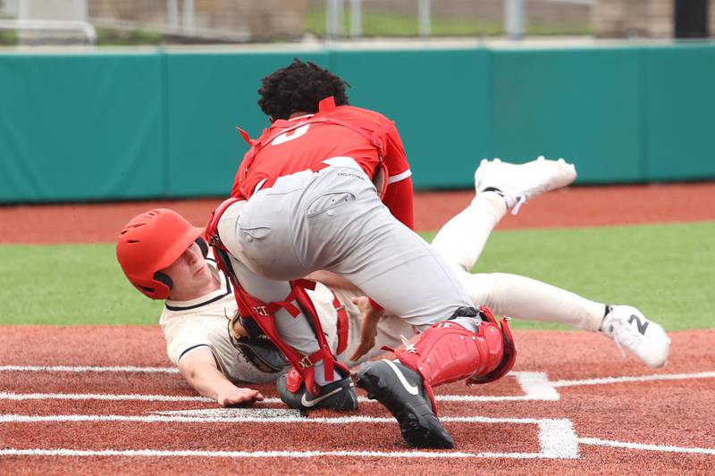 Bradley-Bourbonnais' Andrew Kubal nearly beats the tag at home during the Boilermakers' 8-7 loss to Homewood-Flossmoor on Monday, April 13, 2026.