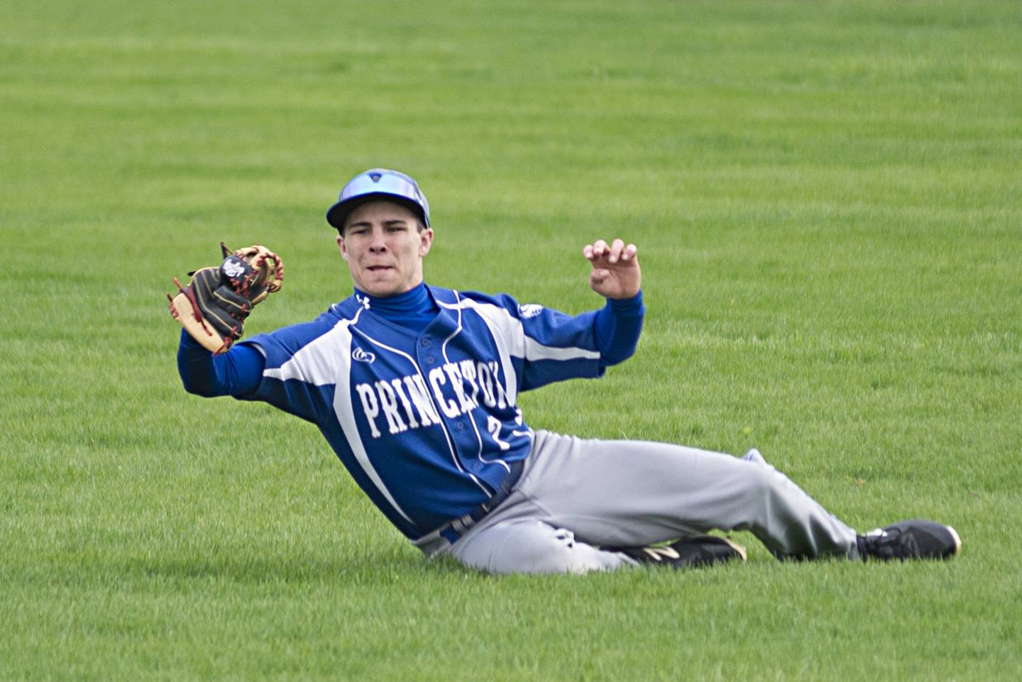 Princeton’s Augie Christiansen makes a sliding catch in rightfield Monday, May 2, 2022 against Newman.