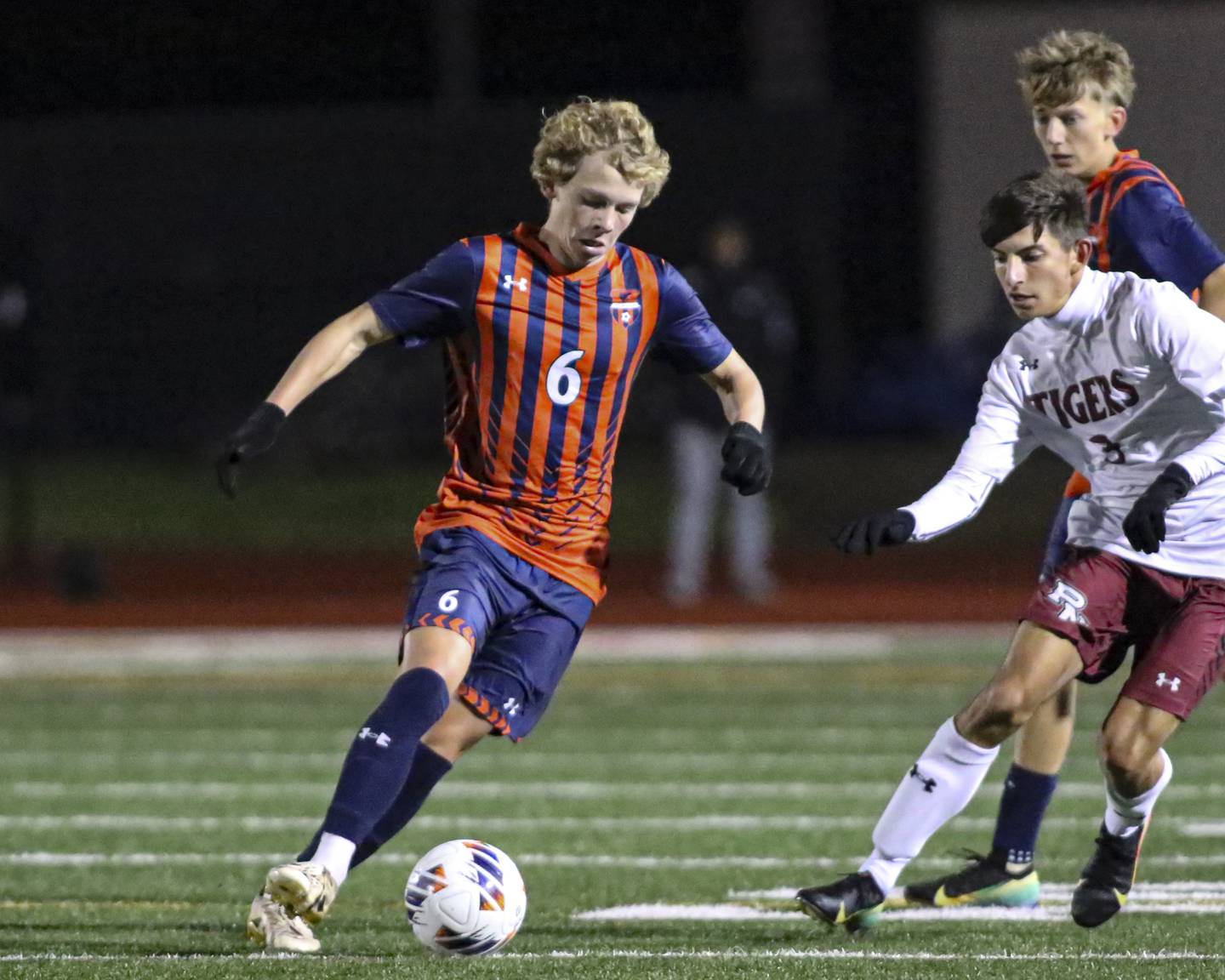 Oswego's Shawn Stogentin (6) advances the ball during Class 3A Naperville Central Regional semifinal soccer match between Plainfield North at Oswego, Tuesday Oct 21, 2025.