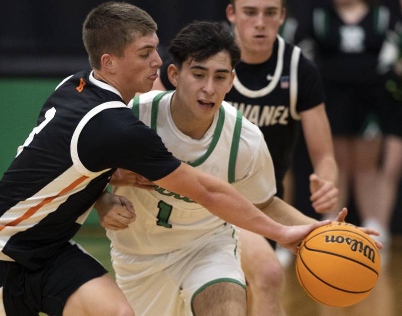 Rock Falls’ Austin Castaneda is fouled by Kewanee’s Greyden Lewis Wednesday, Nov. 27, 2024, at Rock Falls High School.