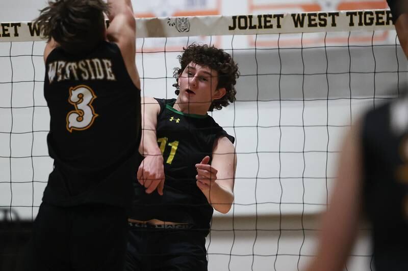 Providence’s Adam DeRubertis eyes a kill against Joliet West on Thursday, March 23, 2023 in Joliet.