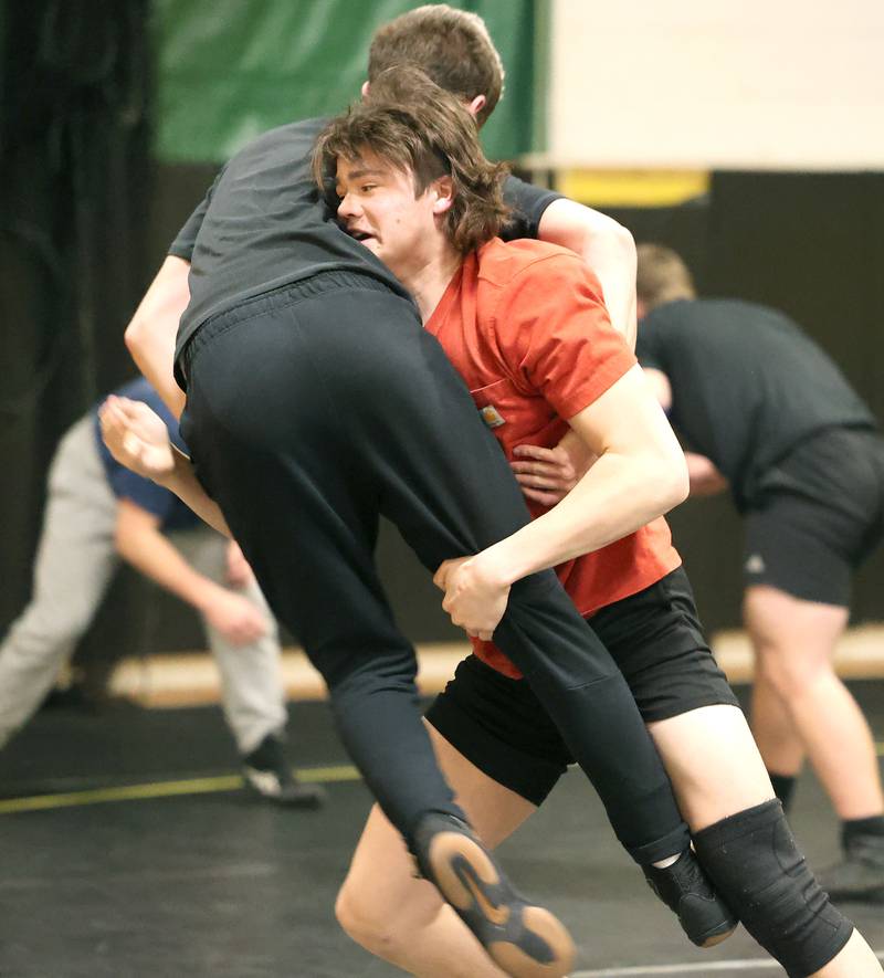 Sycamore wrestler Gabriel Crome (right) works on techniques with a teammate Tuesday, Jan. 31, 2023, at Sycamore High School.