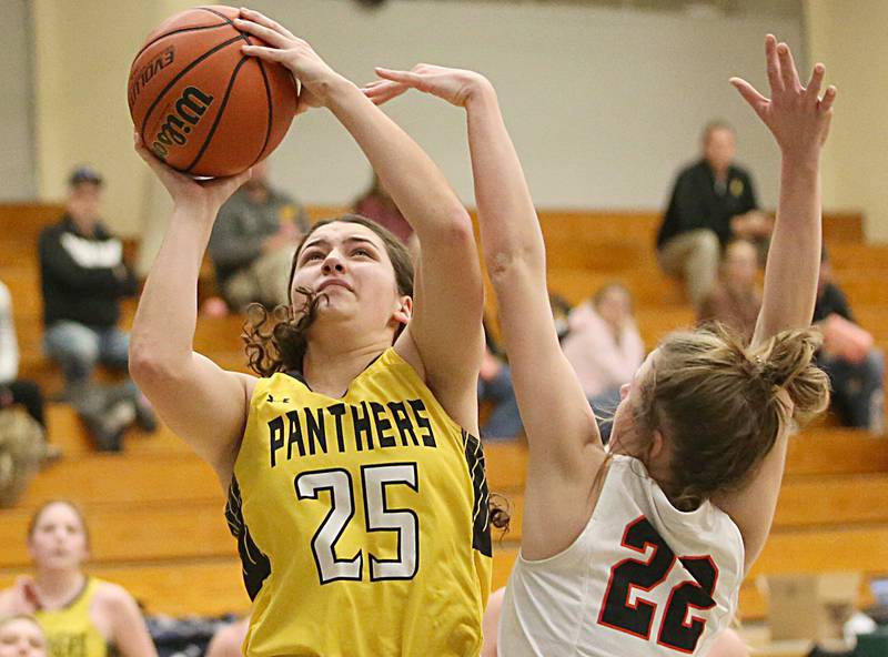 Putnam County's Maggie Richetta shoots a jump shot over Roanokd-Benson's Brianna Harms during the Tri-County Conference Tournament on Tuesday, Jan. 17, 2023 at Midland High School.