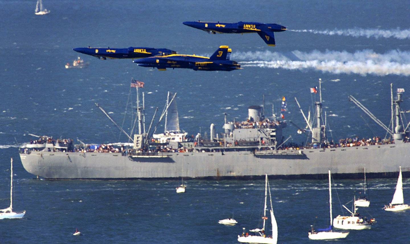 The U.S. Navy Blue Angels fly in formation over the last seaworthy World War II Liberty ship, the S.S. Jeremiah O'Brien, on Oct. 9, 1999, during the Fleet Week 99 airshow in San Francisco. Fleet Week originated in 1908 when President Teddy Roosevelt's "Great White Fleet'' of battleships and destroyers cruised through the Golden Gate.