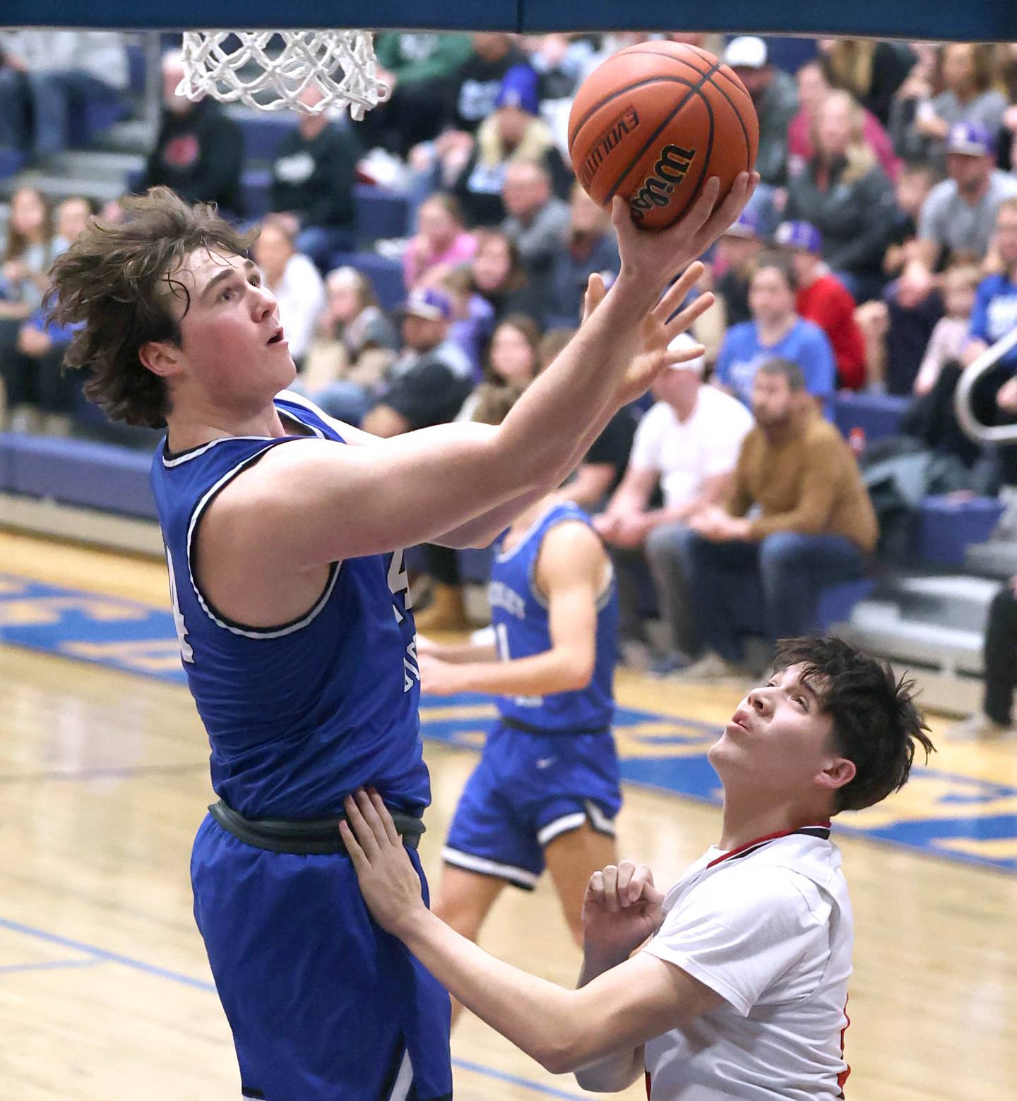 Hinckley-Big Rocks's Martin Ledbetter goes to the basket against Earlville's Oliver Munoz during their game Thursday, Feb. 1, 2024, in the Little 10 boys basketball tournament at Somonauk High School.