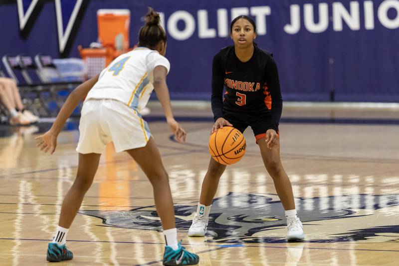 Minooka's Kendall Thomas looks for an opening during a WJOL Girls Basketball Tournament game against Joliet Catholic at Joliet Junior College on Nov. 17, 2025.
