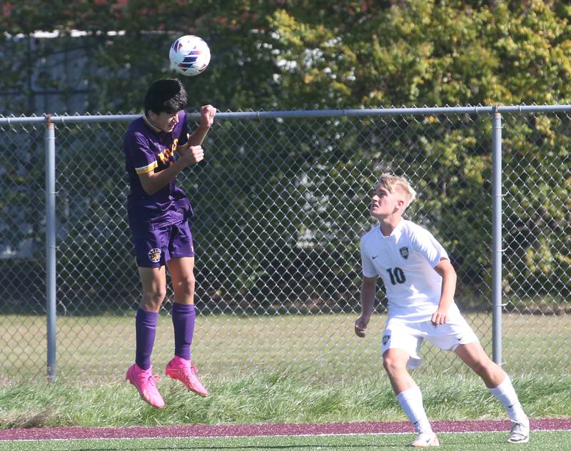 Mendota's Johan Cortez puts a header on the ball as Quincy Notre Dame's Nolan Heck defends during the Class 1A Sectional semifinal game on Saturday, Oct. 21, 2023 at Illinois Valley Central High School in Chillicothe.