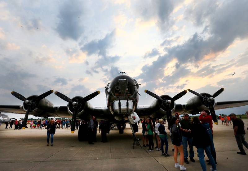 A large crowd gathers around the Yankee Lady B-17 aircraft during the annual TBM Reunion and Airshow on Friday, May 20, 2022 at the Illinois Valley Regional Airport in Peru.