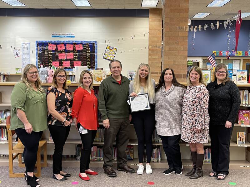 The Glacier Ridge PTA presented the 2022 scholarship award to Caroline Seidenzah on May 12, 2022. Pictured (left to right): Jackie Dracup, PTA president; Julie Sromek, PTA scholarship chair; Assistant Principal Karla Reinhardt; Principal John Jacobsen; Caroline Seidenzah; Crystal Lake Elementary School District 47 Superintendent Kathy Hinz; Susie Massett, second grade teacher; and Gretchen Thomas, extended curriculum teacher.