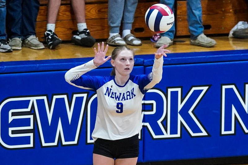 Newark’s Morgen Hergenhahn (9) serves the ball during a non-conference match against Aurora Christian at Newark High School on Tuesday, Sept. 9, 2025.