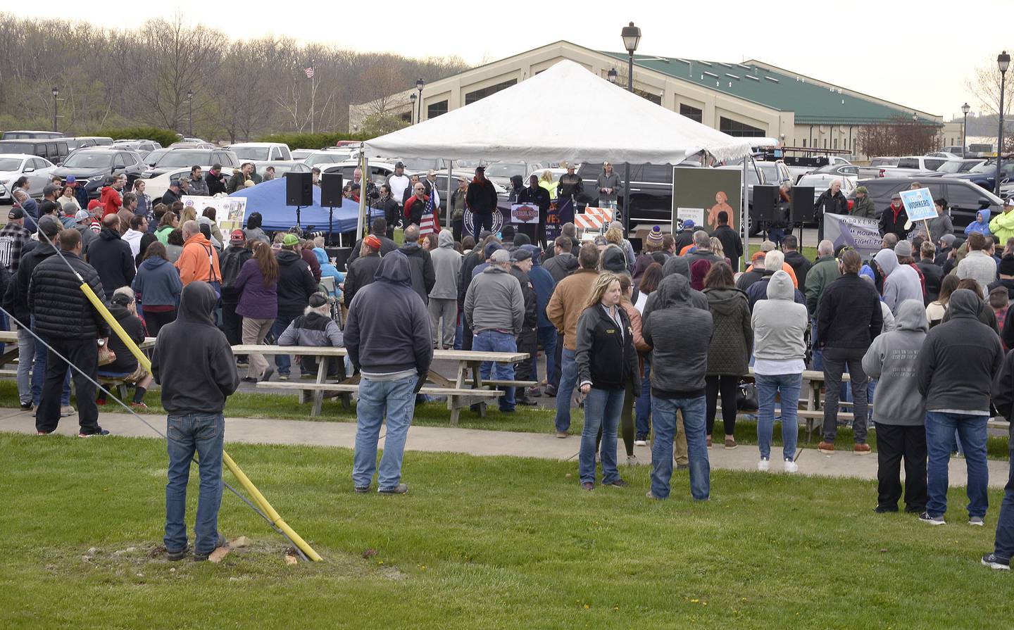 Hundreds gathered in the Illinois Valley Cellular parking lot Thursday, April 28, 2022, in Marseilles, across the street from the recently-erected plaque memorializing Steve Sutton who was killed in a 1932 labor riot. The event featured Rage Against the Machine guitarist Tom Morello and Illinois Gov. JB Pritzker.