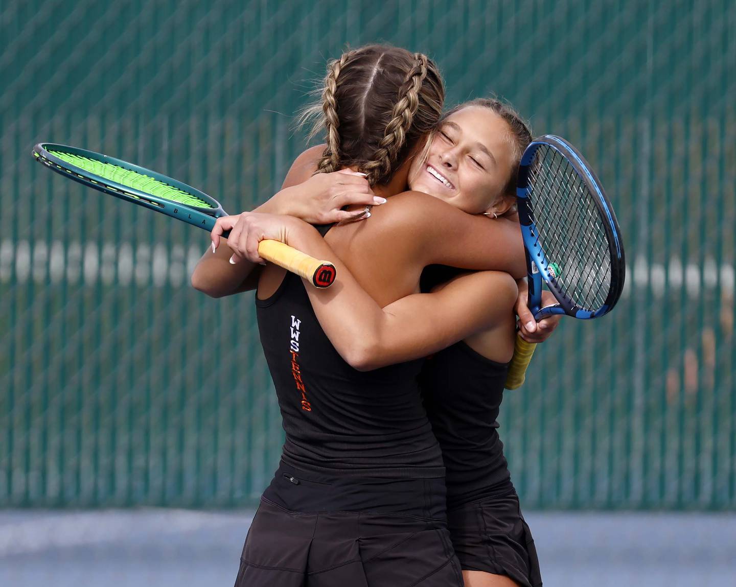 Riley Lepsi and Reese Lepsi of Wheaton Warrenville South react after winning the 2A Doubles Championship match Saturday, Oct. 25, 2025 at John Hersey High School in Arlington Heights.