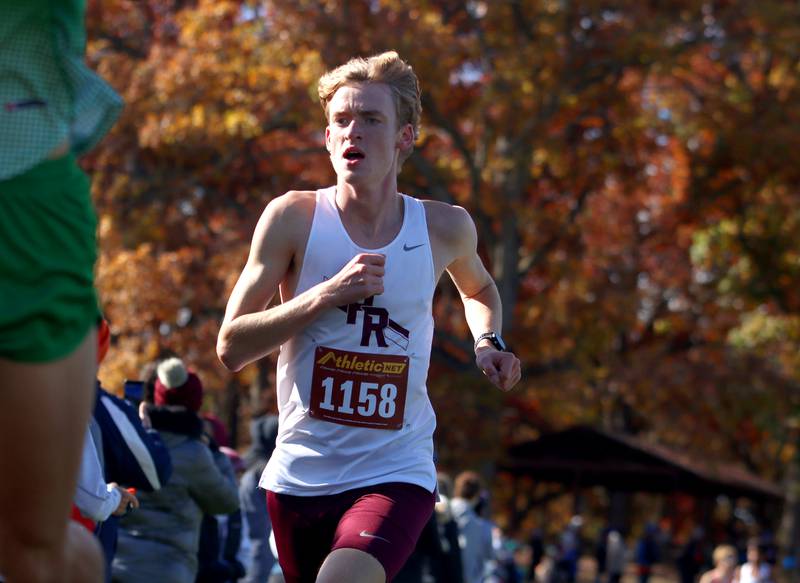 Prairie Ridge’s Will Gelon runs during a boys Class 2A Sectional Cross Country Meet at Emricson Park in Woodstock Saturday.