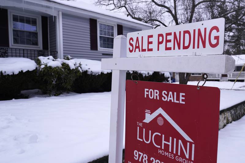 FILE - "Sale Pending" is posted on an existing home for sale real estate sign, Feb. 27, 2023, in Salem, N.H. (AP Photo/Charles Krupa, file)