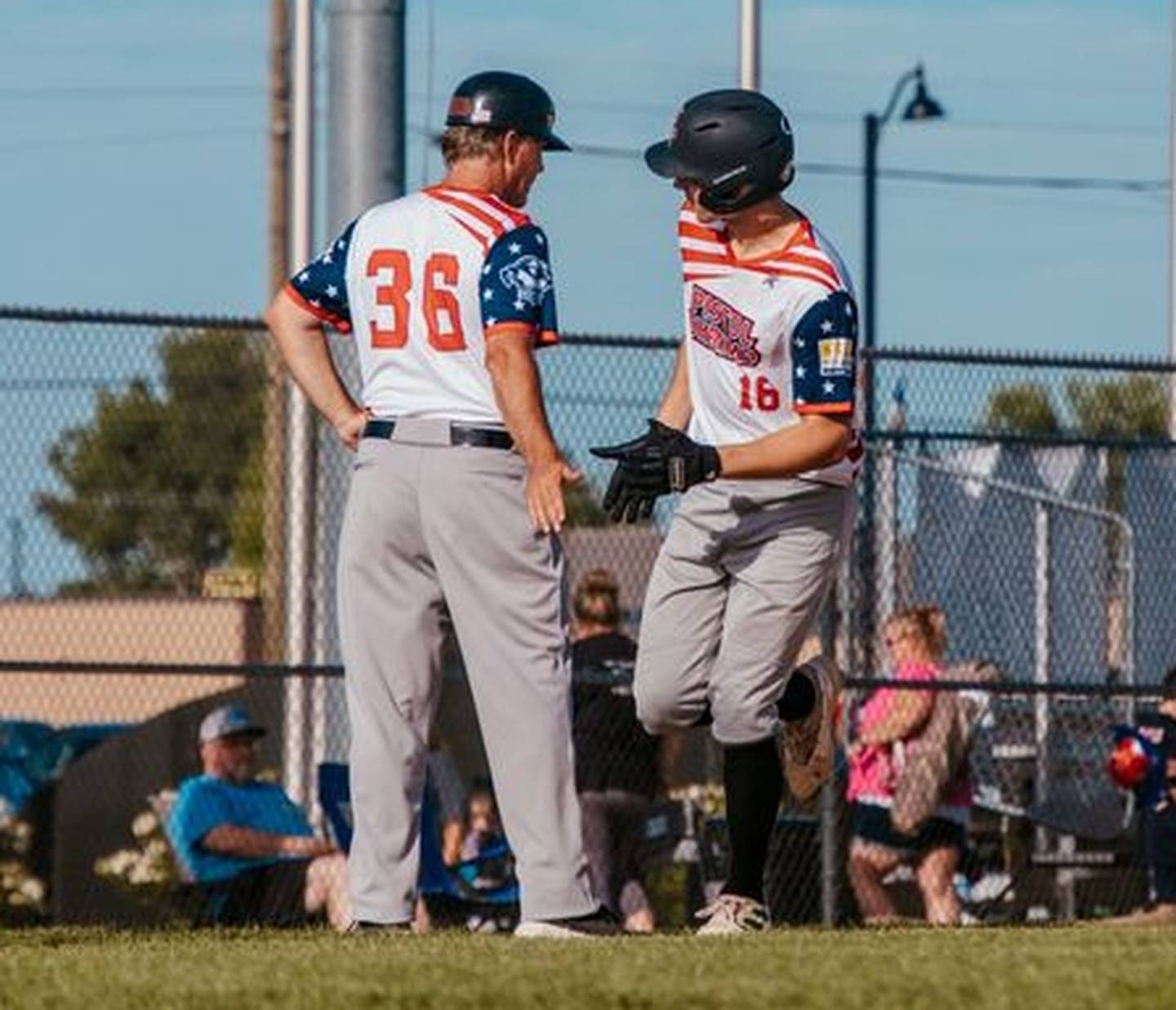 Illinois Valley's Lois Perona high fives manager John Jakiemiec as he rounds third base after hitting a solo home run during the Pistol Shrimp's 7-5 loss to the Danville Dans on Wednesday, July 3, 2024 at Schweickert Stadium in Peru.