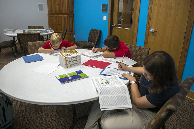 Seventh graders Duncan Buis (left), Aidan Torres and Makenna Scheidecker work on an assignment Wednesday, Sept. 7, 2022 at the newly opened Sauk Valley Christian Academy. The school held their first day on Tuesday.