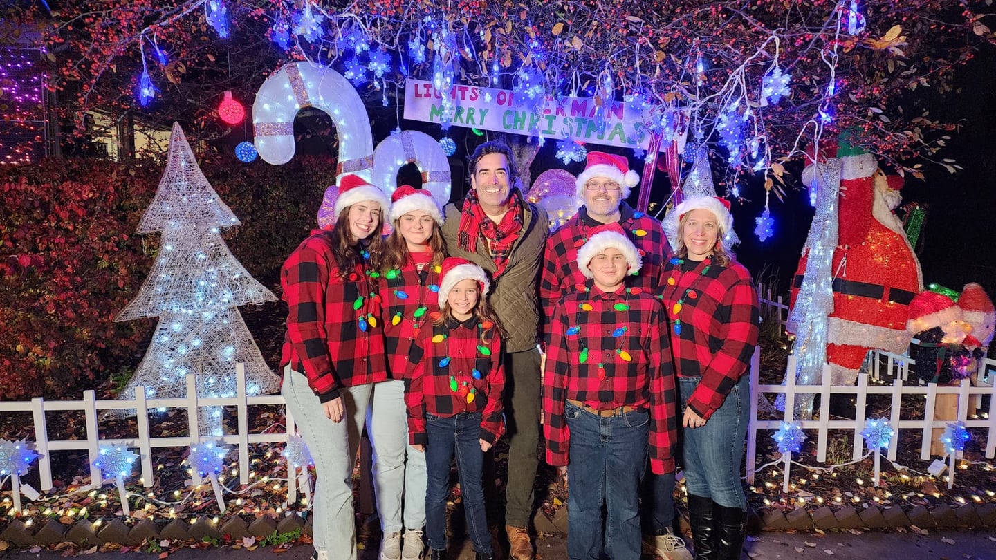 Batavia's Foy family with Carter Oosterhouse (Center) outside their Christmas display, Lights on Ekman, at 969 Ekman Drive during the filming of ABC's The Great Christmas Light Fight in Novemeber 2023.