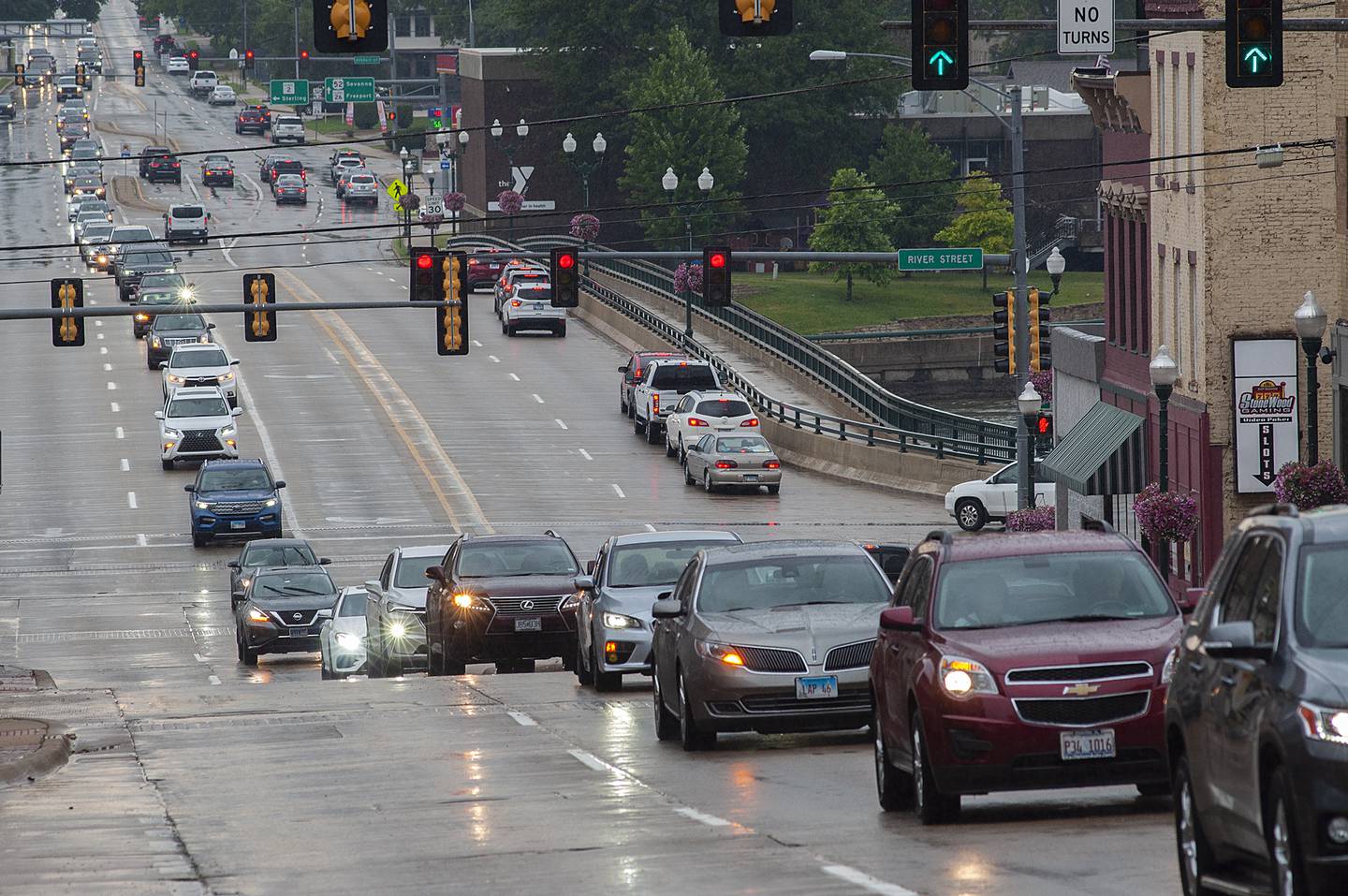 Mourners follow the procession of John Fritts as it makes its way to burial at Oakwood Cemetery Saturday, June 25, 2022.