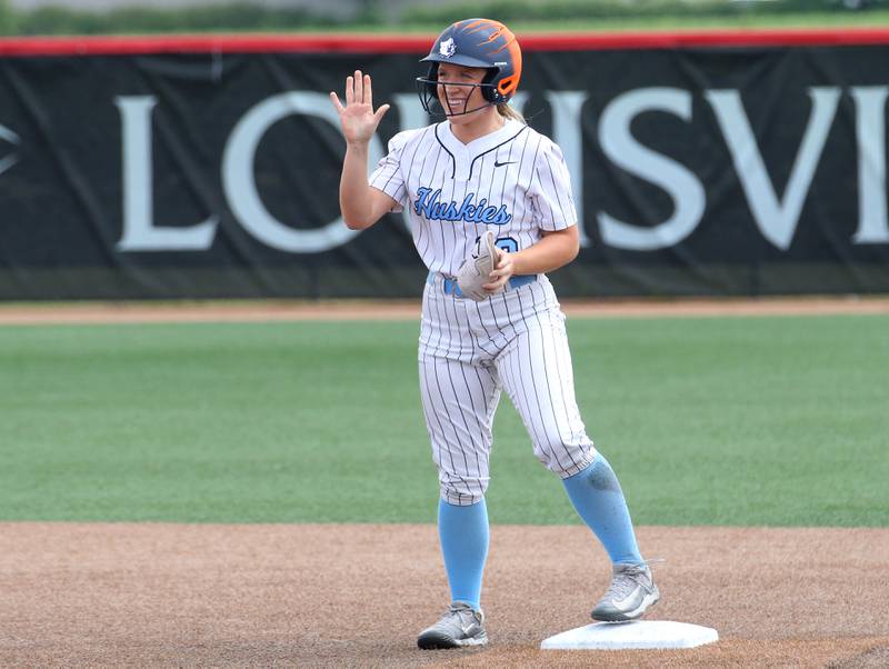 Oak Park River Forest's Maura Carmody waves to the fans after reaching second base during the Class 4A third-place game on Saturday, June 14, 2025 at the Louisville Slugger Sports Complex in Peoria.
