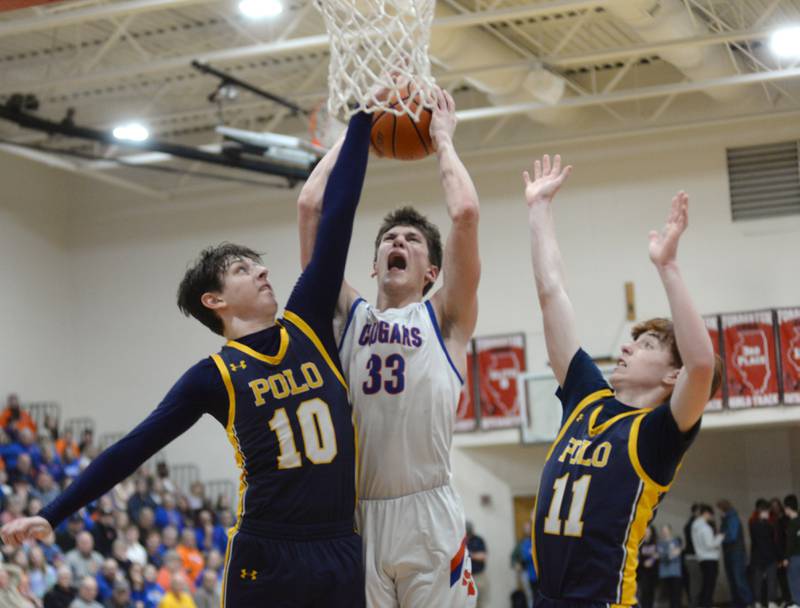Eastland's Parker Krogman (33) shoots as Polo's  Nolan Hahn (11) and Carter Merdian (10) defend on Friday, Feb. 23, 2024 at the 1A Forreston Regional championship game at Forreston High School.