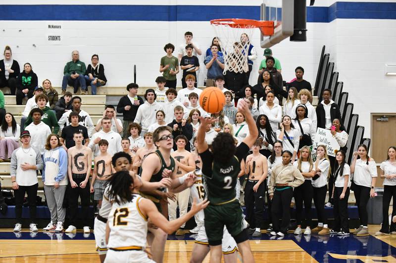 Bishop McNamara's student fan section watches a play during the Fightin' Irish's 79-67 victory over Joliet Catholic Academy in the IHSA Class 2A Peotone Sectional semifinal on March 4, 2025.