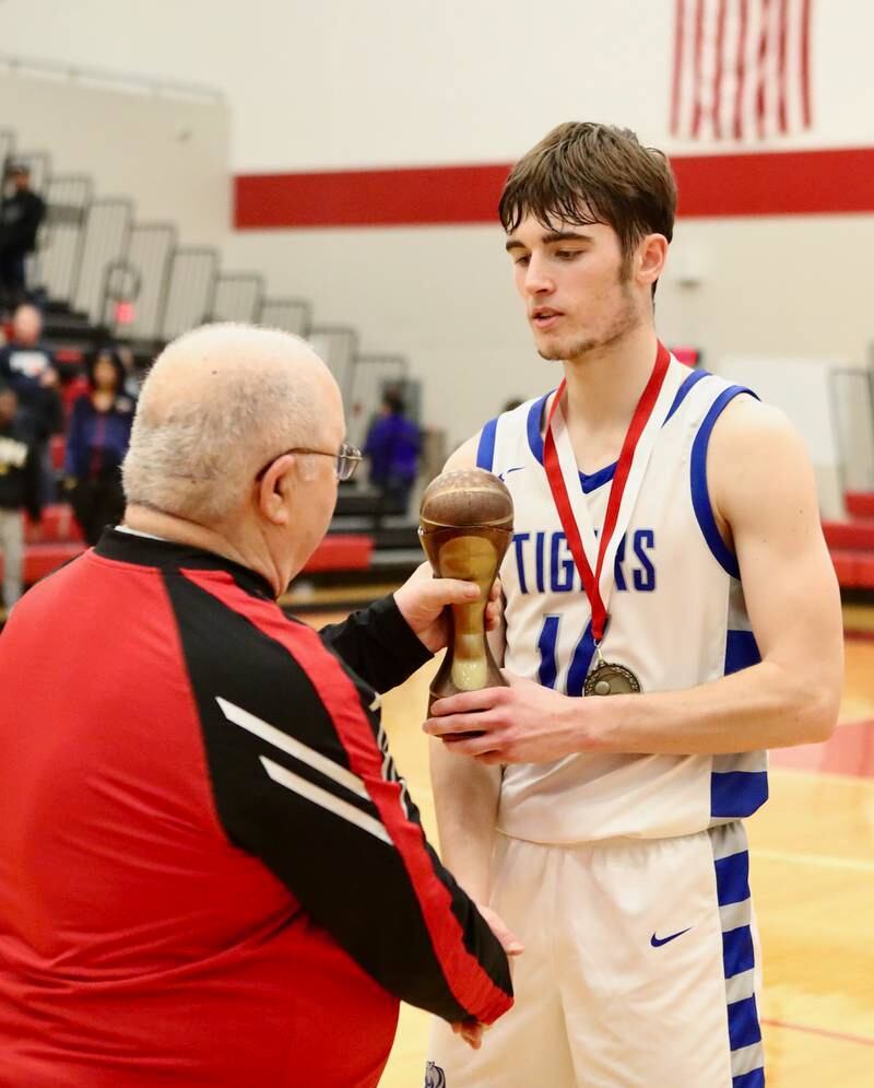 Princeton's Grady Thompson accepts the Colmone Classic MVP trophy from Frank Colmone Saturday.