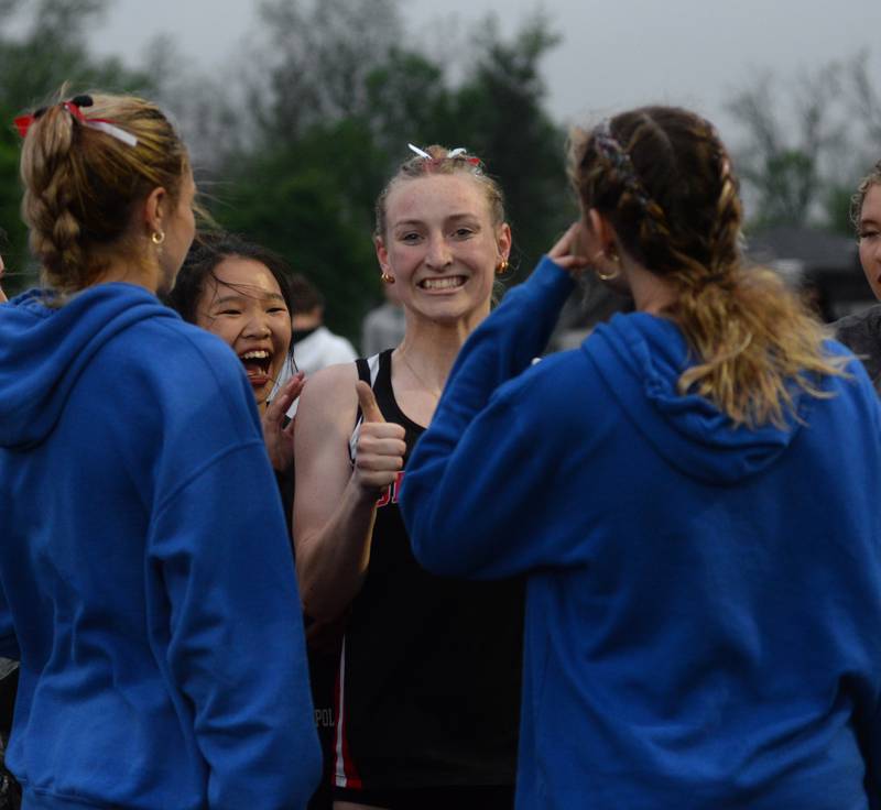 Forreston-Polo's Autum Pritchard gives a thumbs up as she is congratulated by teammates after qualifying for the state meet in the 400 meters at the 1A Winnebago Sectional on Friday, May 12.