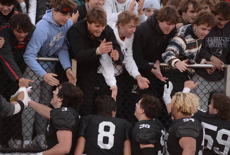 Fenwick's players including rush the fans during their victory against Brother Rice Saturday, Nov. 2, 2024.