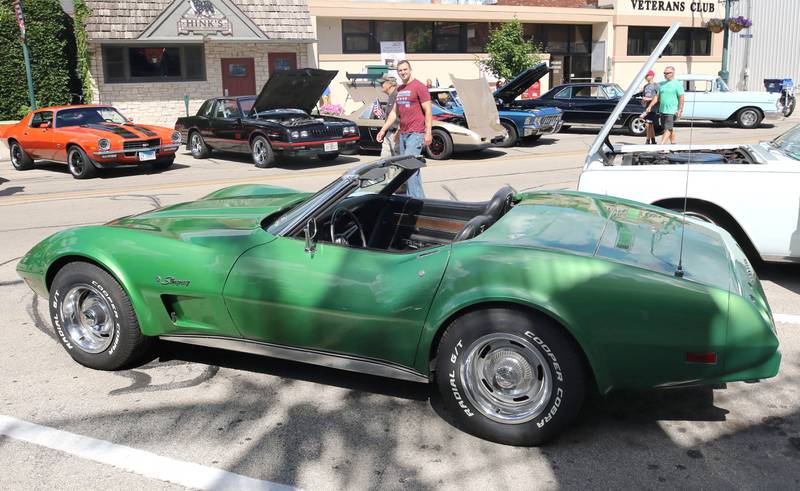 Visitors check out a vintage Corvette on South California Street in Sycamore Sunday, July 31, 2022, during the 22nd Annual Fizz Ehrler Memorial Car Show.