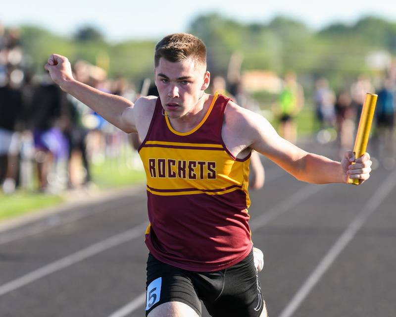 Jack Martens  of Richmond-Burton crosses the finish line during the 100 meter relay at the Kishwaukee River Conference track meet on Tuesday May 7, 2024, held at Plano High School.
