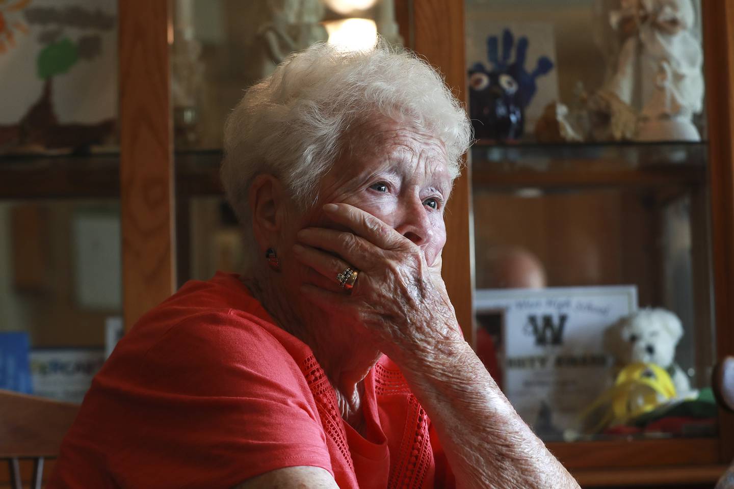 Georgia Donisch listens to learns about the process through which her father, Arthur Countryman's remains were identified on Tuesday, July 13, 2021, at her nephew Brian Papesh's home in Plainfield, Ill.