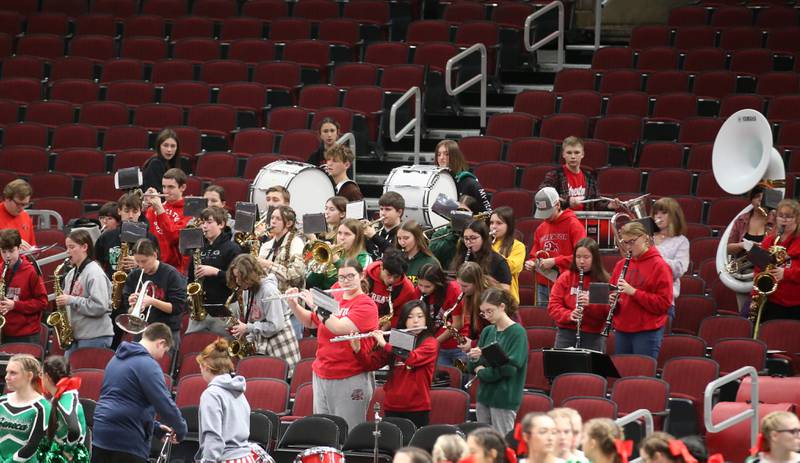 Members of the Streator and Seneca bands perform together during a game on Tuesday, Dec. 21, 2023 at the United Center in Chicago.