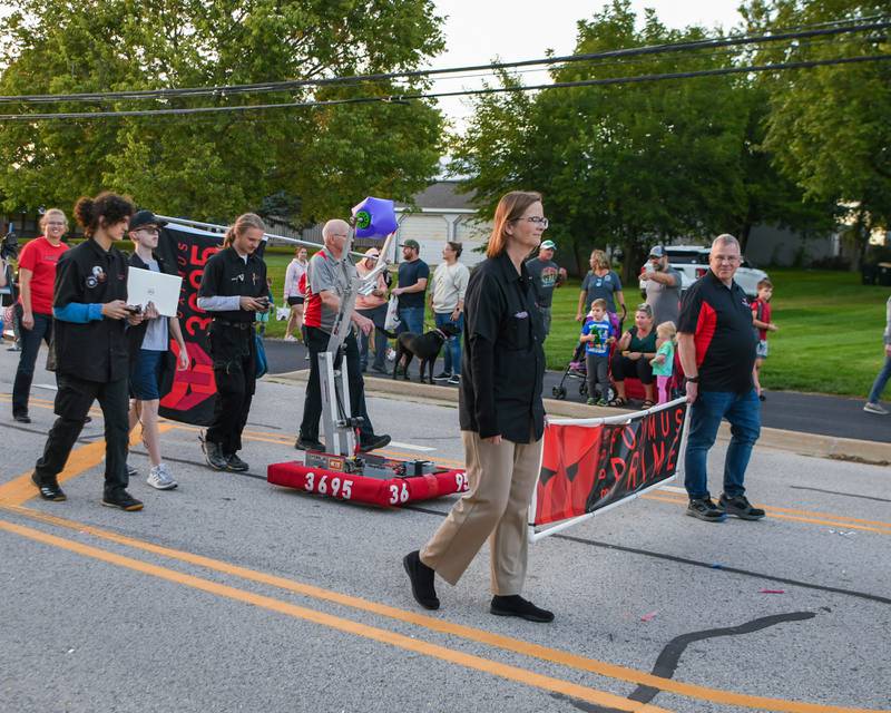 Yorkville robotics team, Foximus Prime, shows off a robot during the Yorkville homecoming parade held on Thursday, Sept. 28, 2023.