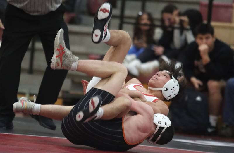 Huntley’s Colin Abordo, top, battles Crystal Lake Central’s Jackson Marlette at 116 pounds in varsity wrestling on Friday, Dec. 13, 2024 at Huntley High School in Huntley.