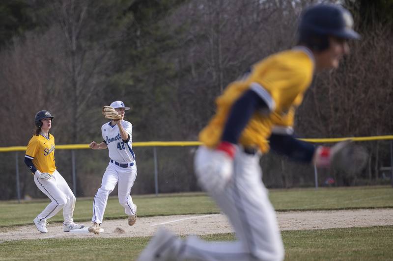 Newman’s Chase Decker fields a ball at third against Sterling Tuesday, March 12, 2024.