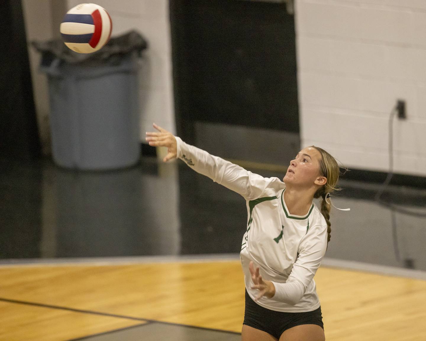 St. Bede libero Ella Herms serves against Putnam County during the game on September 21, 2023 at Putnam County High School.