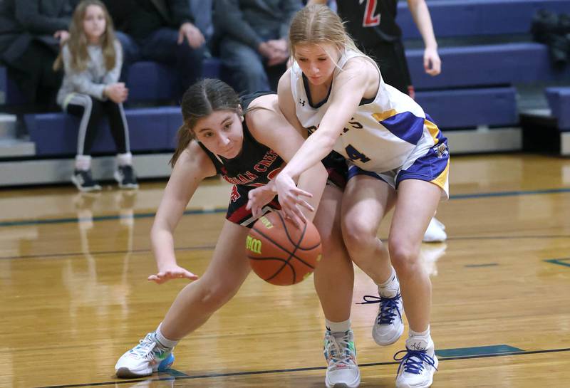 Indian Creek's Hannah Gonzalez (left) and Somonauk's Katelyn Curtis go after a loose ball during their game Monday, Jan. 9, 2023, at Somonauk High School.