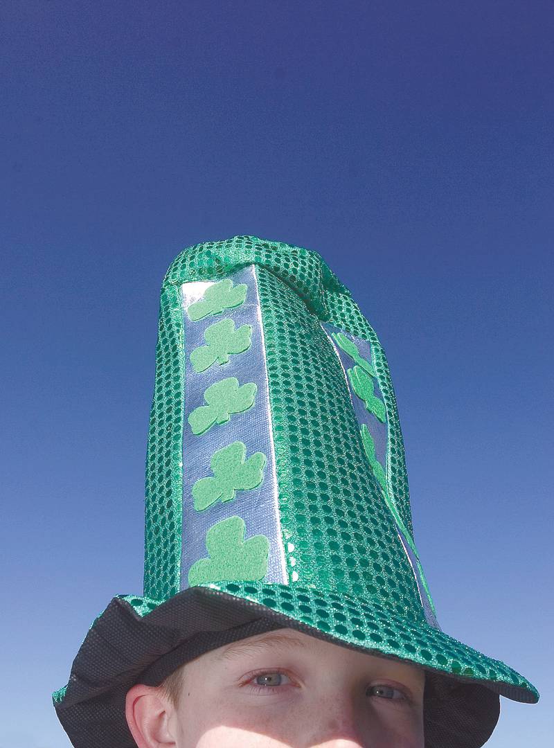 2009 File: Eli Monier, 11, of Dixon wears his tall, green hat proudly during Dixon's St. Patrick's Day parade.