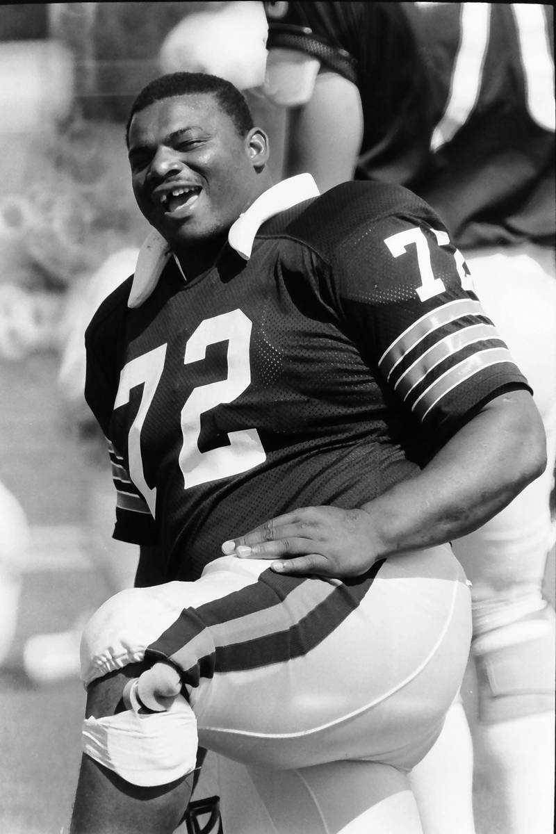 Chicago Bears lineman William Perry smiles for the camera during training camp on Wednesday, June 12, 1985 in Platteville Wis.