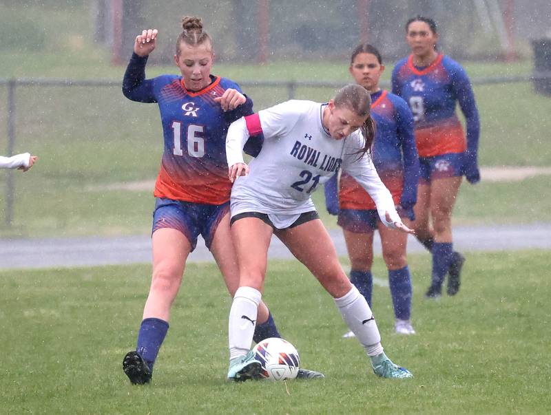 Genoa-Kingston's Ally Poegel (right) and Rockford Christian's Lydia Sherburne try to win possession Tuesday, May 20, 2025, during their Class 2A regional final game at Rockford Christian High School.