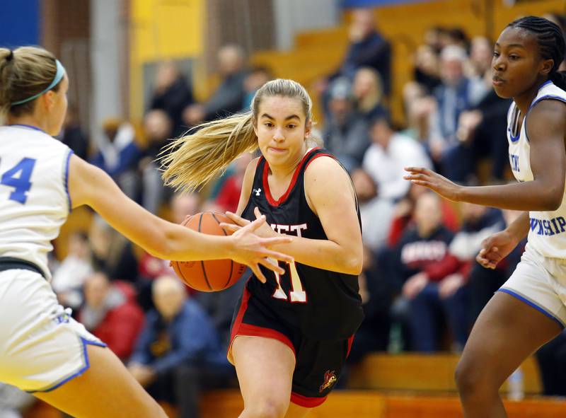 Benet's Sadie Sterbenz (11) drives to the basket during the girls varsity basketball game between Benet Academy and Lyons Township on Wednesday, Nov. 30, 2022 in LaGrange, IL.