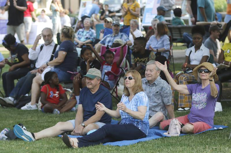 People clap along with the music during McHenry County’s first Juneteenth celebration on Saturday, June 17, 2023, at the Historic Woodstock Square. The Juneteenth festival featured McHenry County College graduate Rodney Katushabe and Pastor Norval Brown of the Cary United Methodist Church, along with music from gospel singer Darlene Benton and jazz musician Ken Davis.