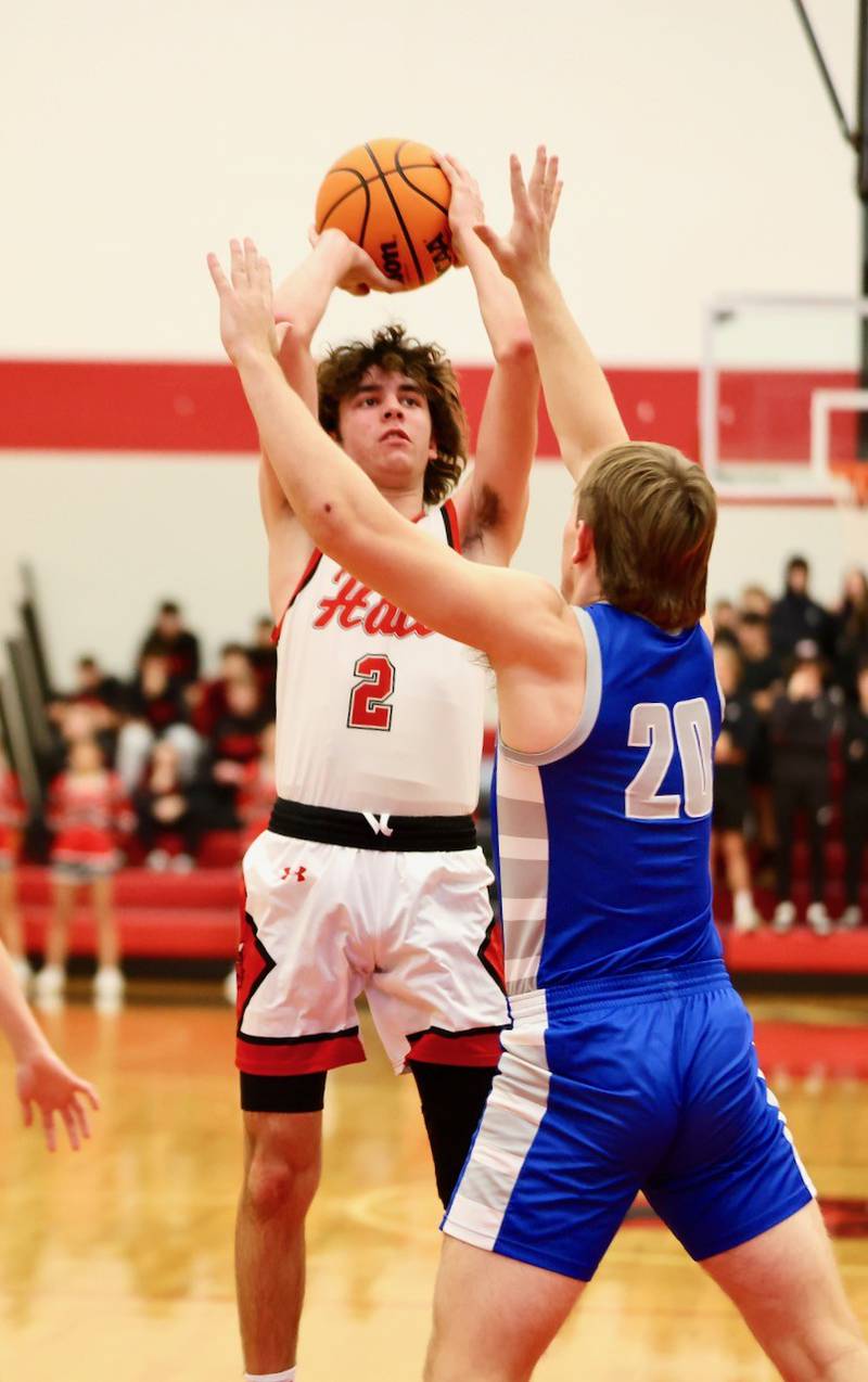 Halls Luke Plym shoots over Princeton's Arthur Burden at the Colmone Classic on Friday night.