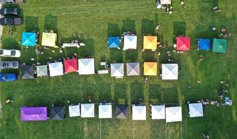 An aerial view of vendor booths during the Friday Night Market's event on Friday, Aug. 18, 2023 at Kirby Park in Spring Valley. These well-loved markets, traditionally held on the third Friday of each month, moved from the downtown location in the mini park to the captivating and spacious Kirby Park. Fireworks concluded the event.