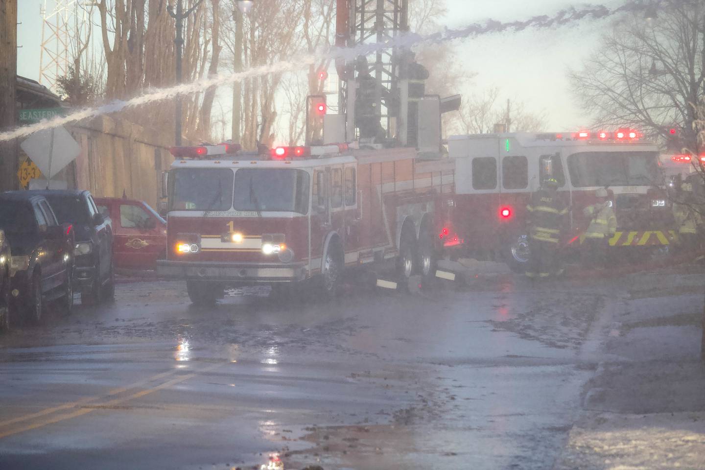 Joliet firefighters at the scene of a fire at an old commercial building on Thursday, Jan. 29, 2026, at the corner of South Eastern Avenue and Washington Street in Joliet.