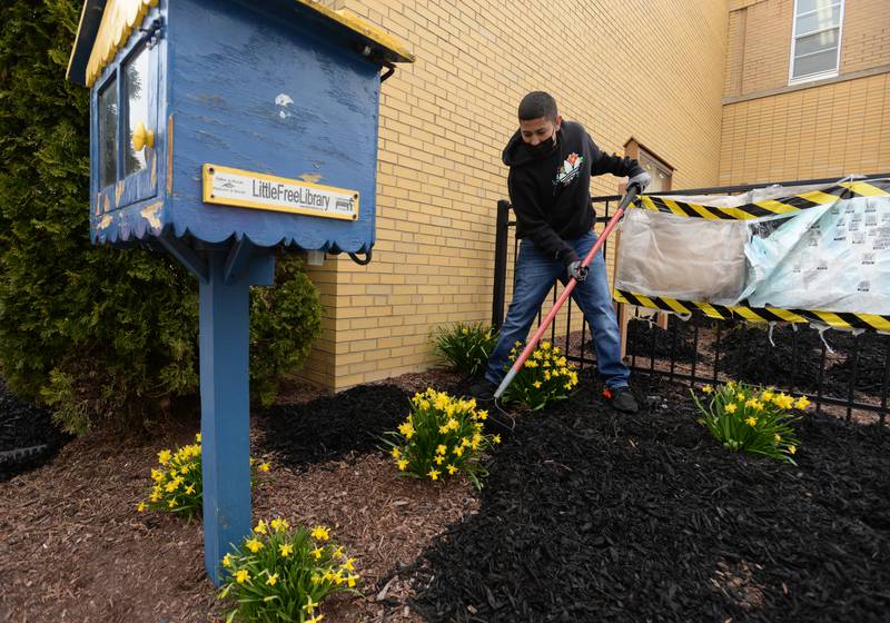 Heritage Middle School and Instructional Special Ed Science 8th grader AJ Canelo helps spread mulch during the Beautification day held in collaboration with Home Depot and the school's OAV Club Wednesday April 20, 2022.